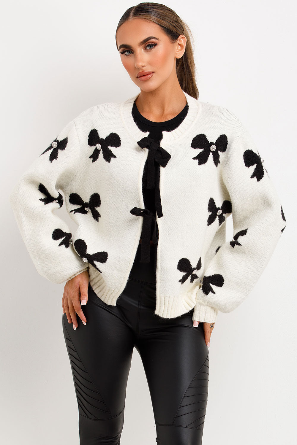 knitted-contrast-lace-up-white-cardigan-with-black-bows-graphic-and-diamente-buttons-styledup-fashion.jpg